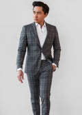 Abbey Road Charcoal Check Suit, full front view on a model with an open collar