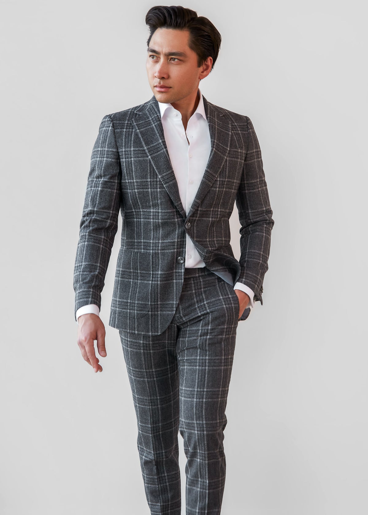 Abbey Road Charcoal Check Suit, full front view on a model with an open collar