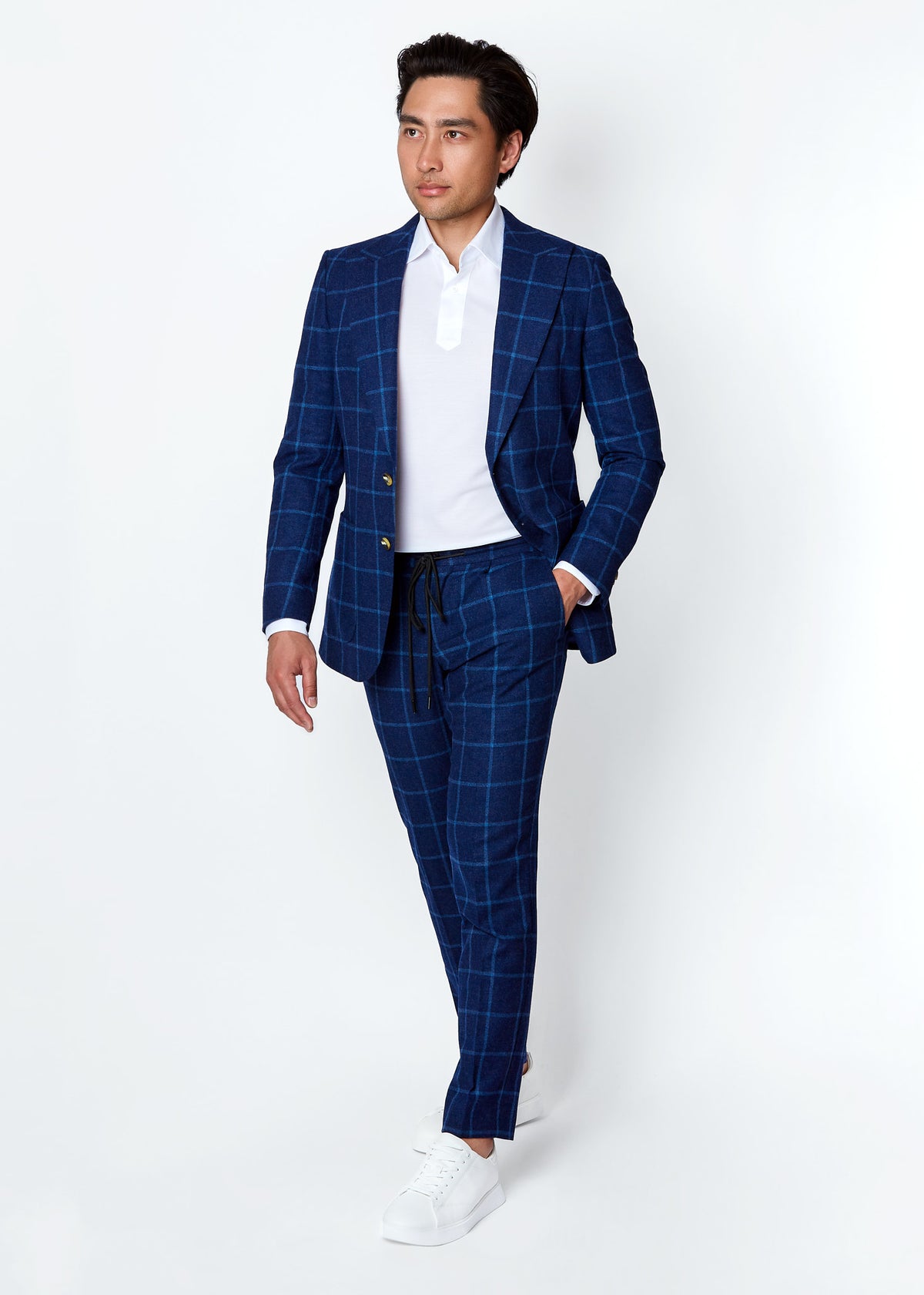Cumberland Blue Windowpane Suit on a model, full front view while walking