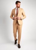 Berkeley Beige Suit, full-length shot of a model walking and adjusting the jacket button