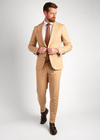 Berkeley Beige Suit, full-length shot of a model walking and adjusting the jacket button