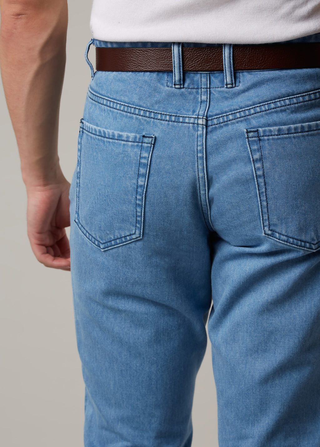 Light Blue Denim Jeans, close-up back view of the pockets and belt