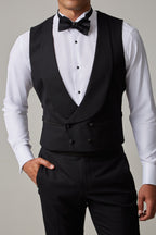 The Great Black Tuxedo waistcoat in shirtsleeves, closer crop front view with hand in pocket