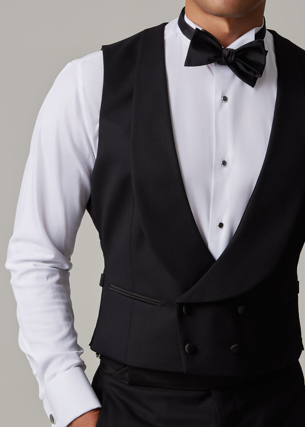 Close-up of The Great Black Tuxedo waistcoat with model's head turned to the side