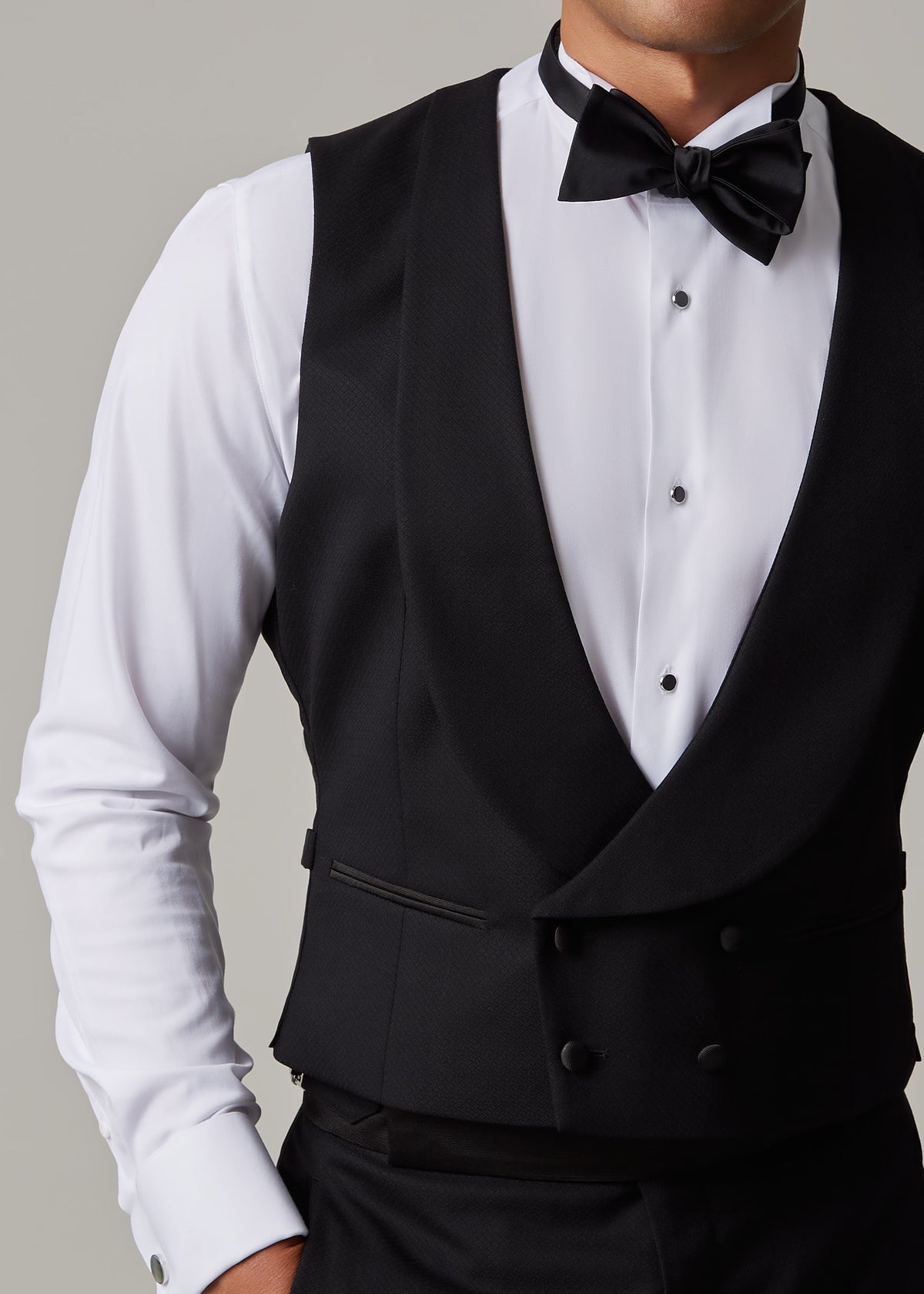Close-up of The Great Black Tuxedo waistcoat with model's head turned to the side