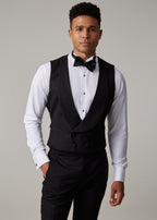 The Great Black Tuxedo waistcoat in shirtsleeves, full front view with hand in pocket