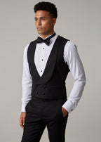 The Great Black Tuxedo double-breasted waistcoat worn in shirtsleeves, model looking aside