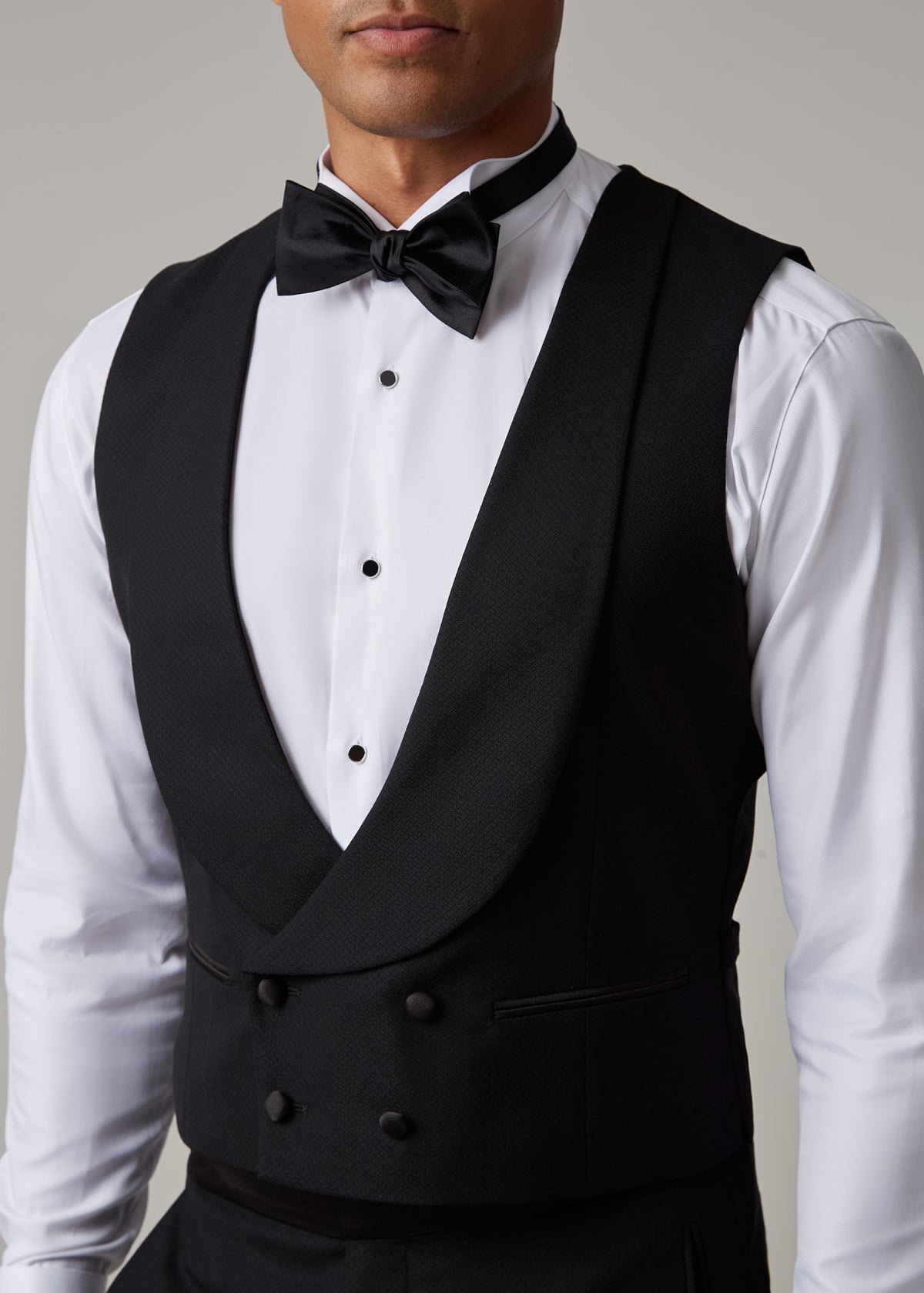 Close-up of The Great Black Tuxedo waistcoat shawl lapel and bow tie