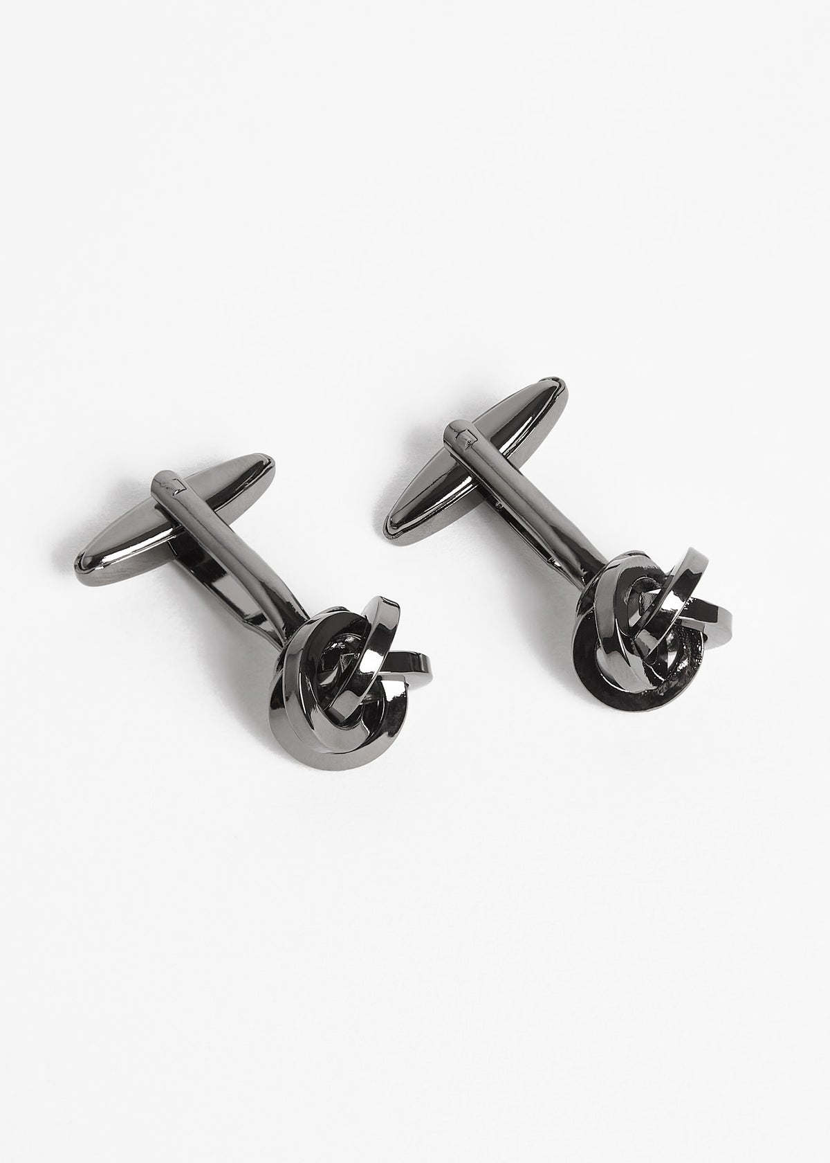Gunmetal Twist Cufflinks arranged diagonally with the toggle bars visible