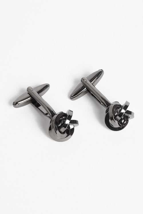 Gunmetal Twist Cufflinks arranged diagonally with the toggle bars visible