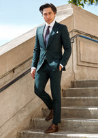 Chicago Tie styled with a dark green suit on a model, outdoors on stone steps