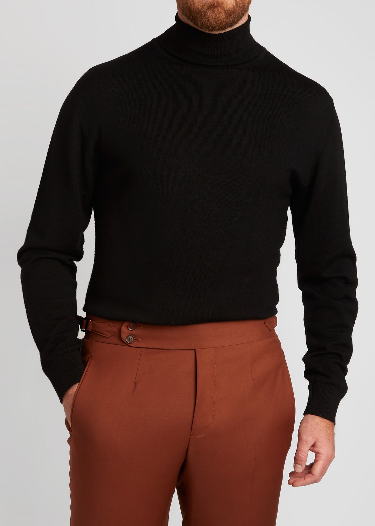 Irish Coffee Turtleneck Black worn close-up with rust-toned trousers