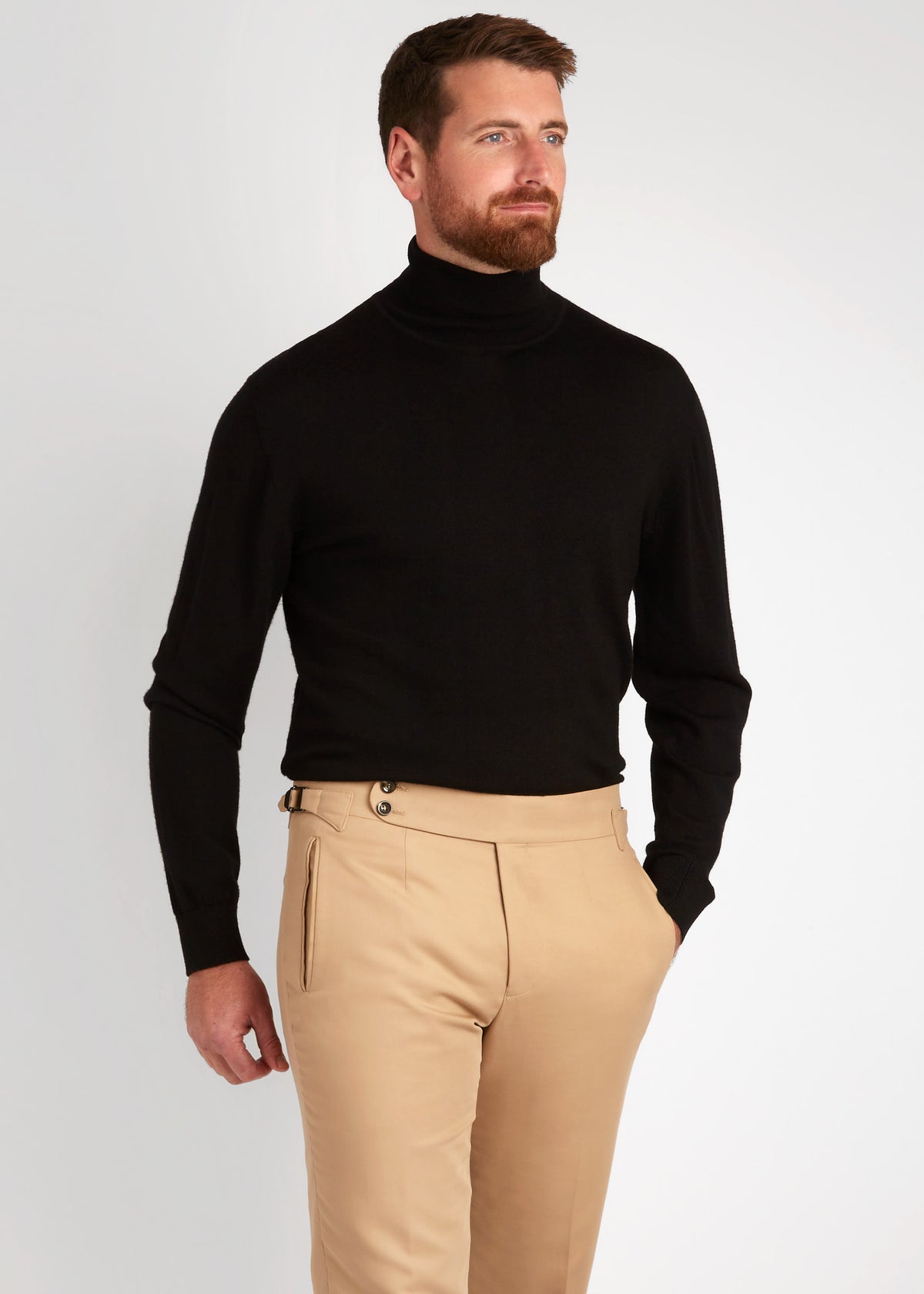 Irish Coffee Turtleneck Black worn with tan trousers, three-quarter turn
