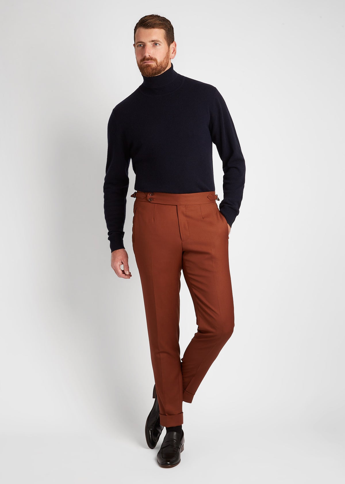Irish Coffee Turtleneck Navy worn alone with rust trousers, full front view