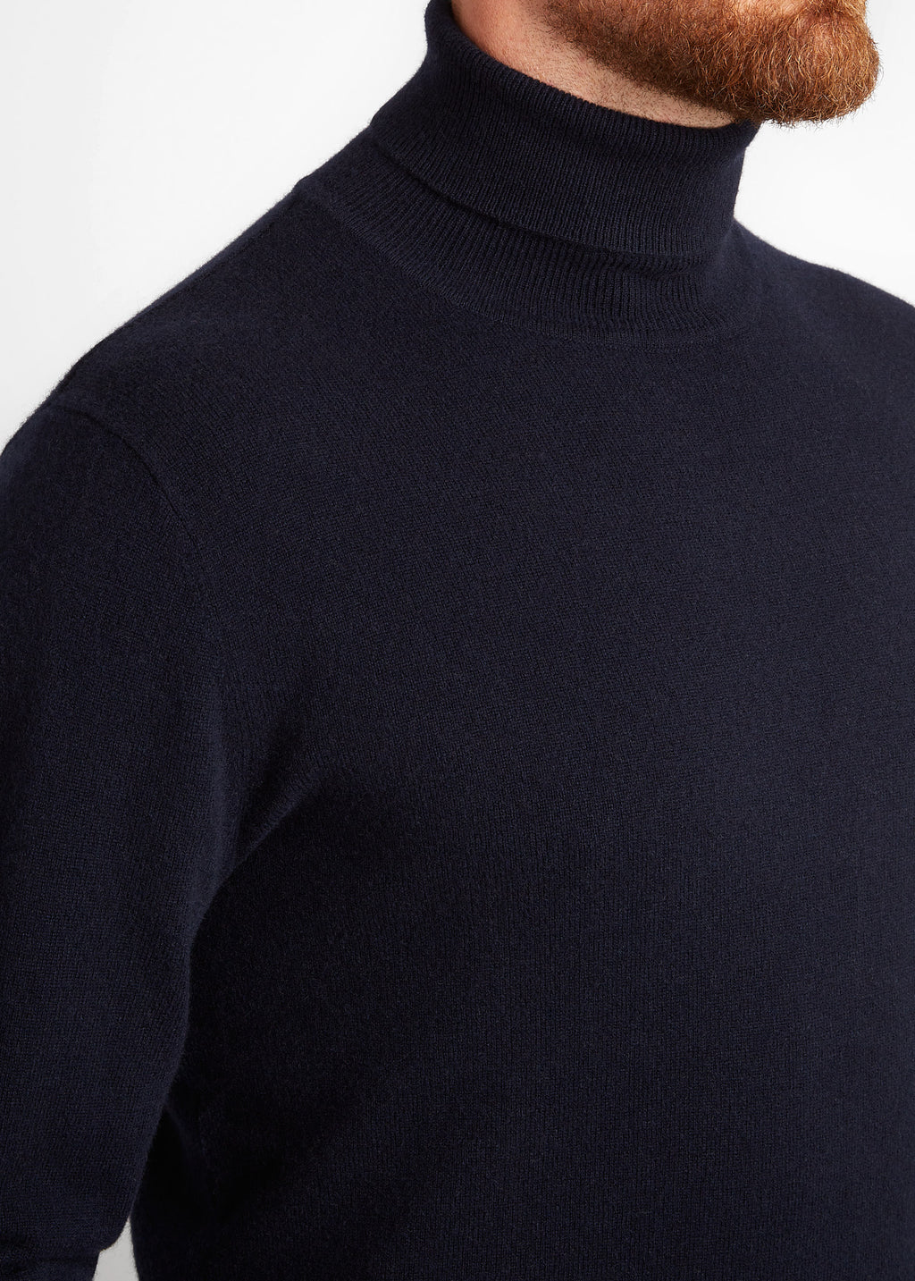 Irish Coffee Turtleneck Navy, close-up side view of the ribbed roll neck