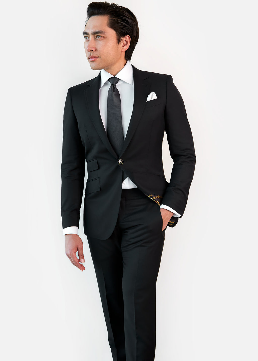 Amsterdam Silk Tie worn with a black suit on a model, hand in pocket