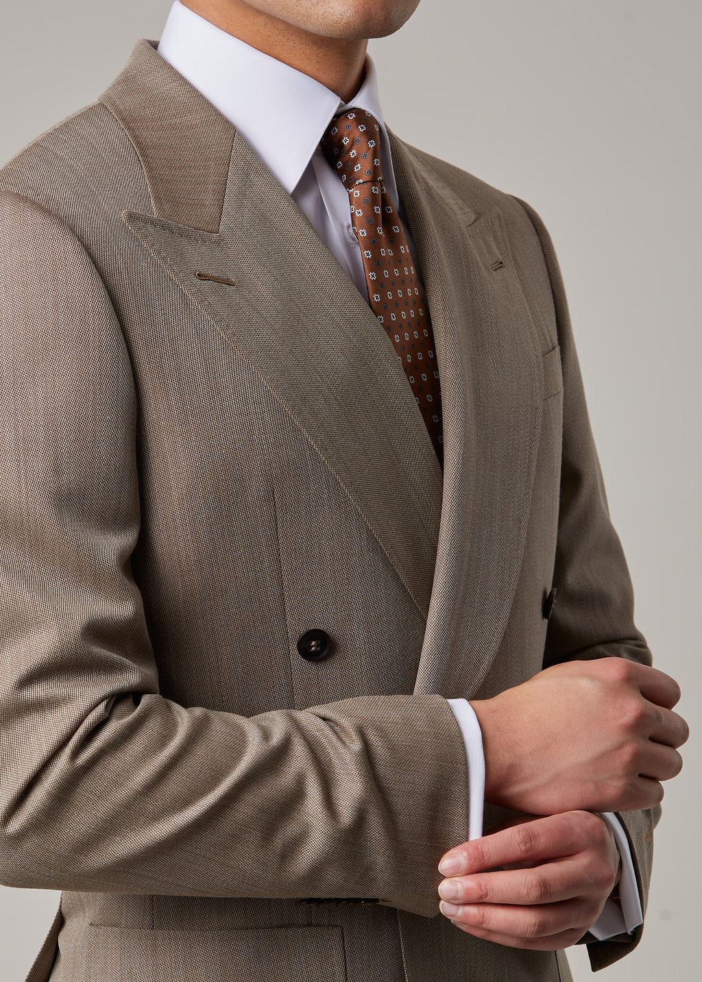 Parkside Light Brown Suit, close-up with hands clasped showing cuff and lapel