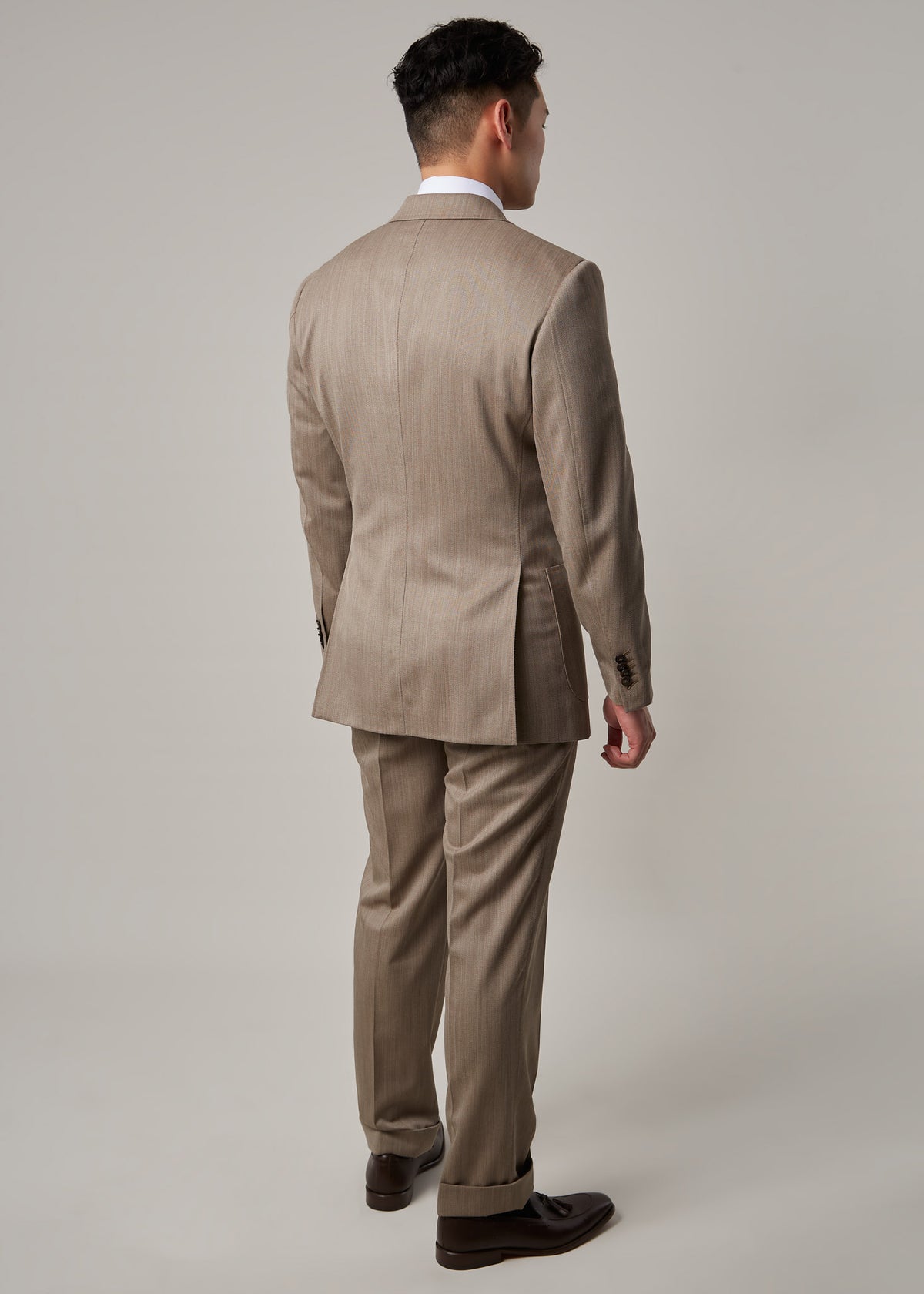 Parkside Light Brown Suit on a model, full back view standing straight