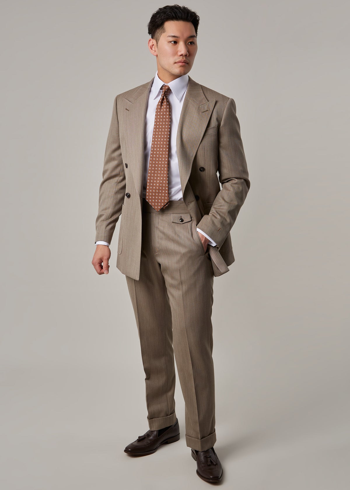 Parkside Light Brown Suit on a model, full front view with jacket open and hand in pocket