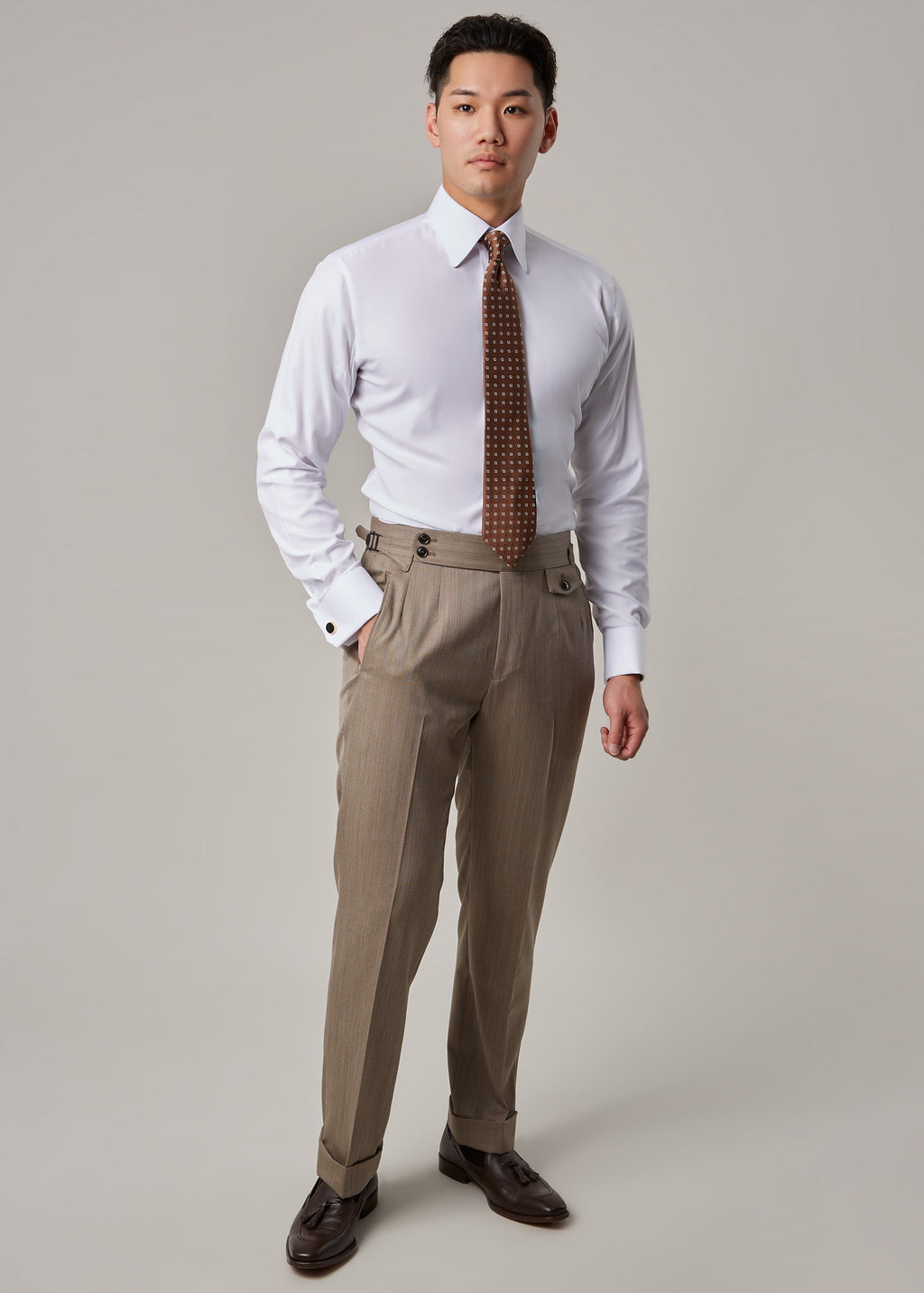 Parkside Light Brown Suit, full front view on a model wearing just shirt and tie