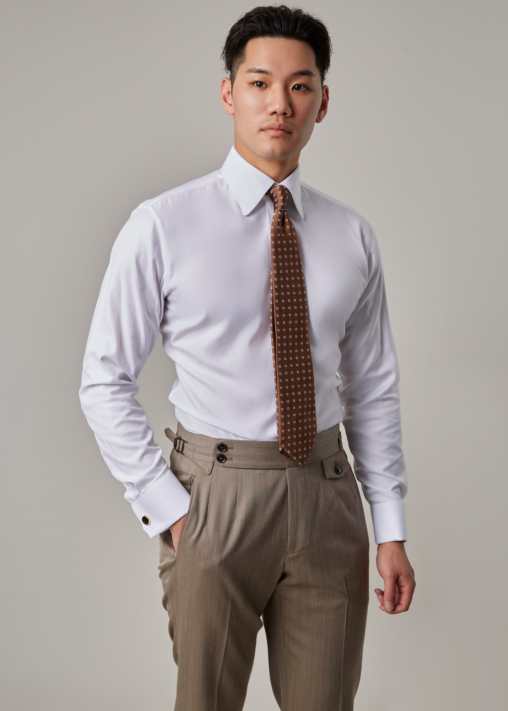 Parkside Light Brown Suit, model in shirt and tie with jacket removed, hand in pocket