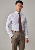 Parkside Light Brown Suit, model in shirt and tie with jacket removed, hand in pocket