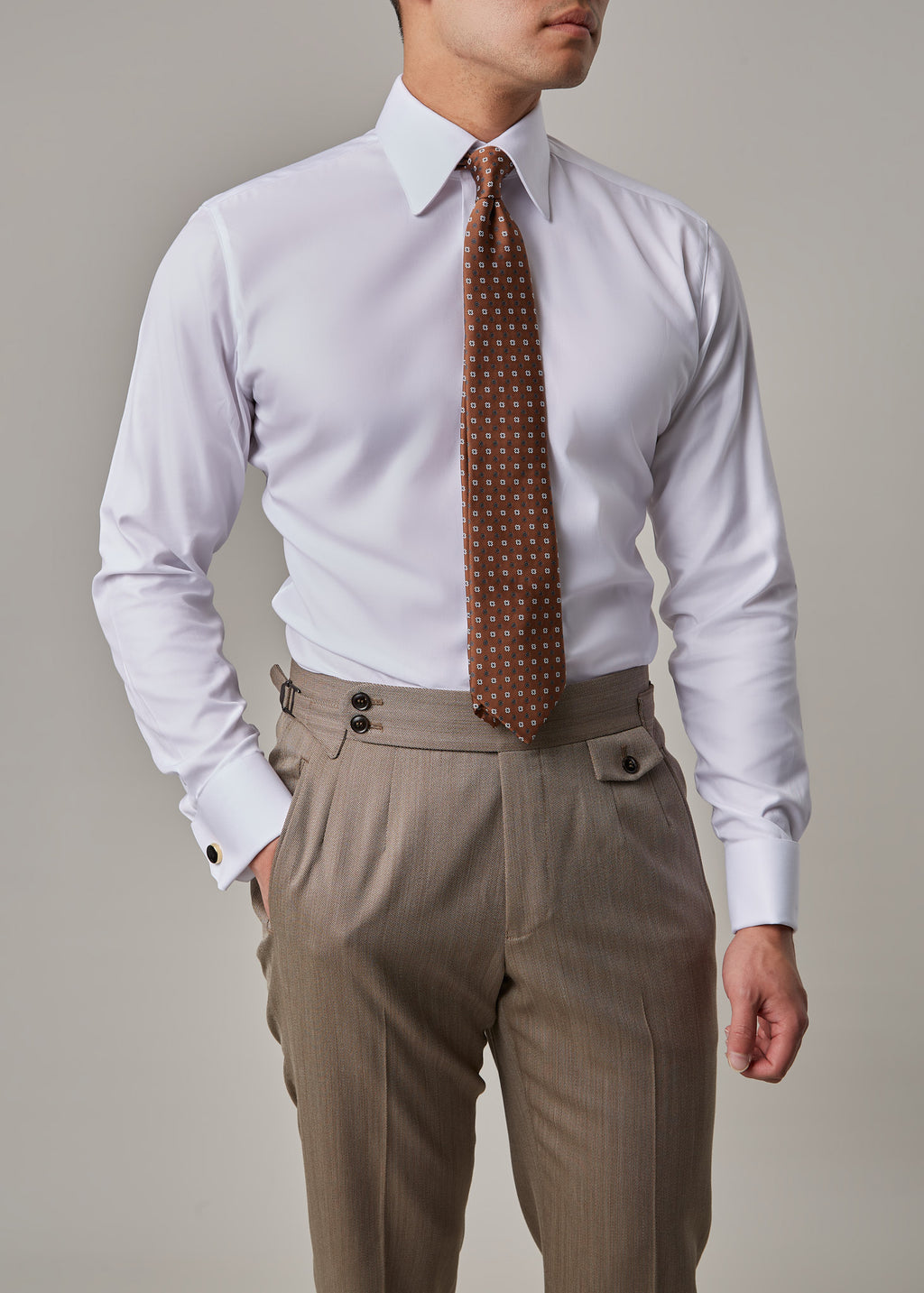 Parkside Light Brown Suit, closer crop of shirt and trousers with hand in pocket