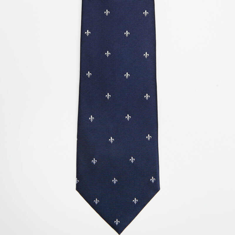 Montreal Silk Tie Blue Fleur de Lis in a flat lay, full length front view