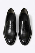 The Morton Black Leather Penny Loafer, pair viewed from above on a white background