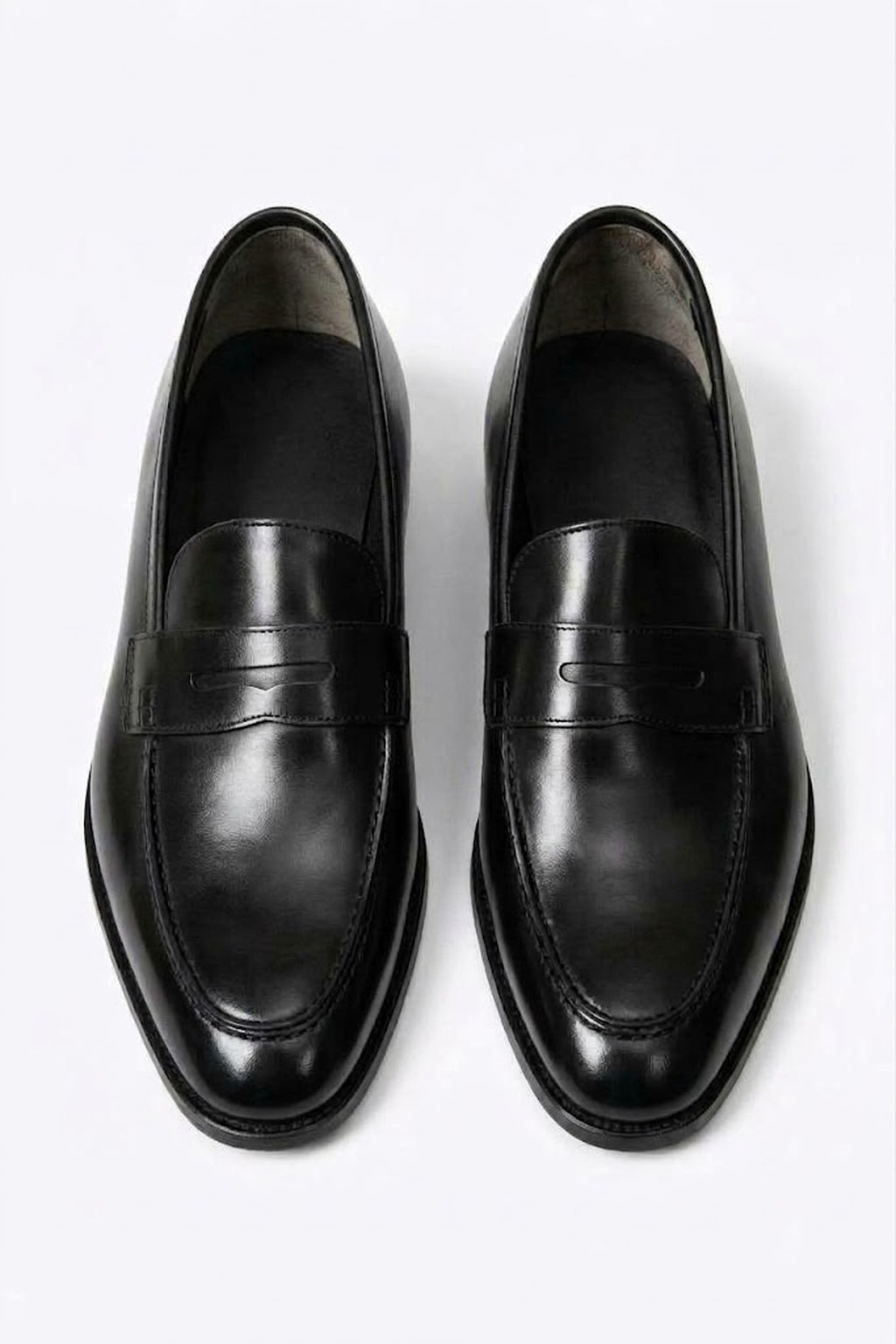 The Morton Black Leather Penny Loafer, pair viewed from above on a white background