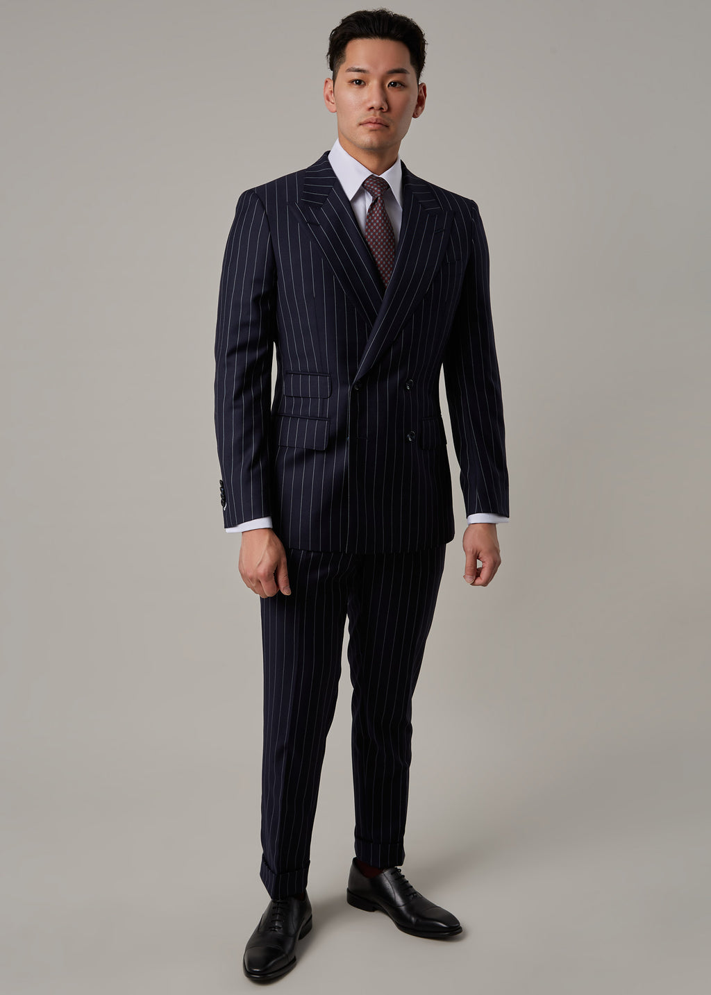 Greenwich Pinstripe Suit worn on a model, full front view with arms relaxed at sides