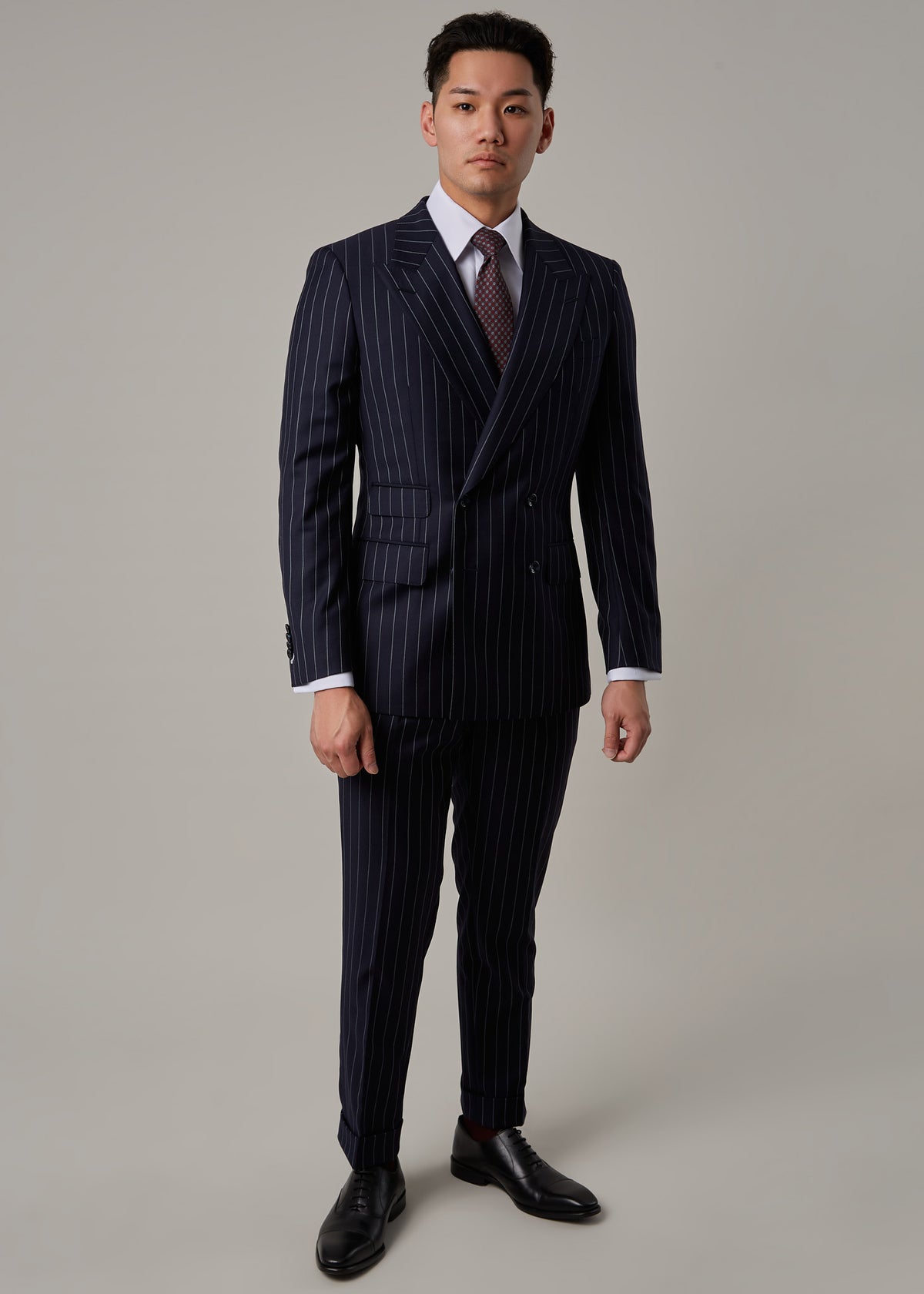 Greenwich Pinstripe Suit worn on a model, full front view with arms relaxed at sides