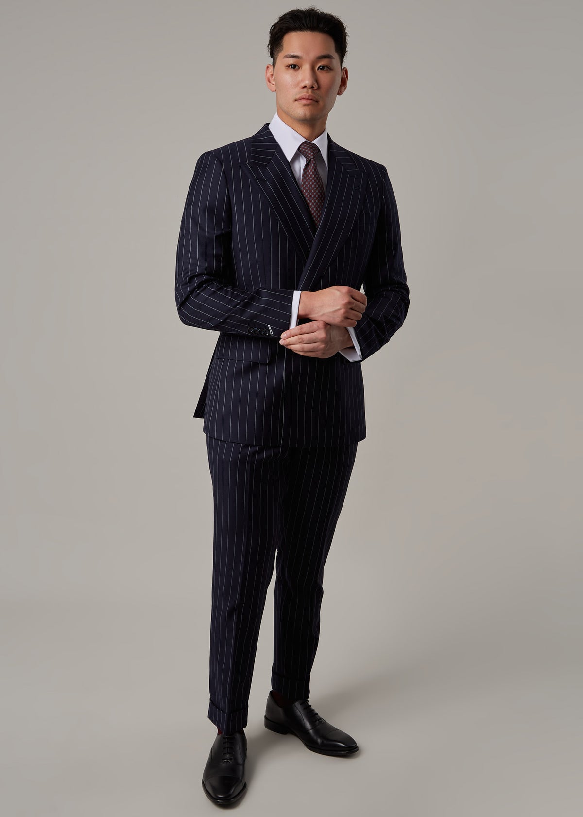 Greenwich Pinstripe Suit, full length view with hands clasped in front