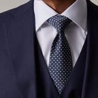 Closer crop of the Rialto Royale Navy Suit tie knot and waistcoat buttons