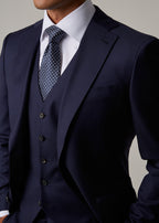 Close-up of the Rialto Royale Navy Suit peak lapel, buttonhole and tie knot