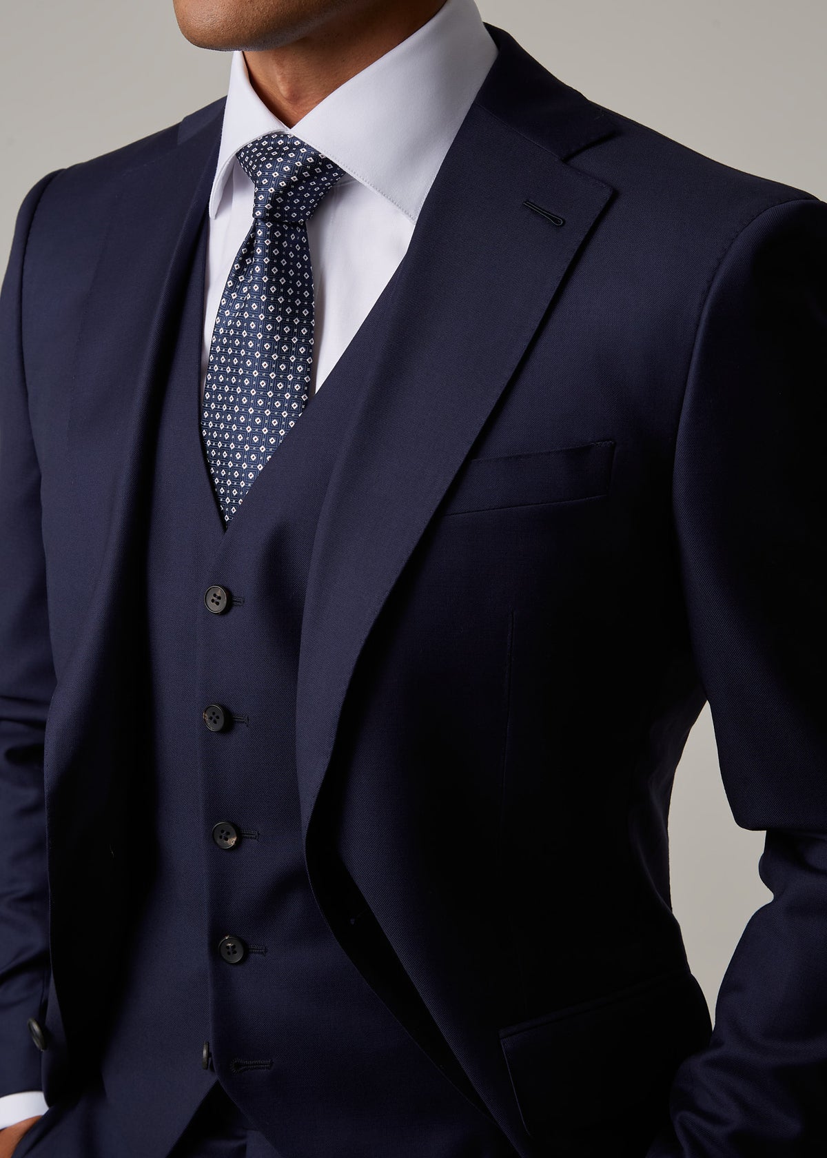 Close-up of the Rialto Royale Navy Suit peak lapel, buttonhole and tie knot