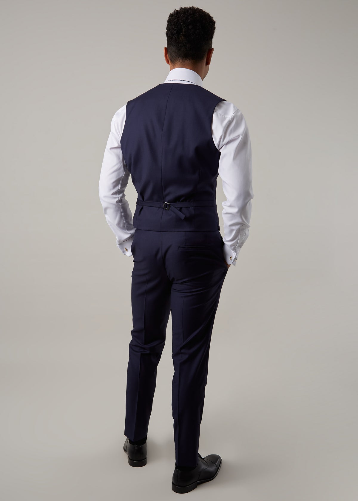 Rialto Royale Navy Suit waistcoat worn over a white shirt, back view, full length