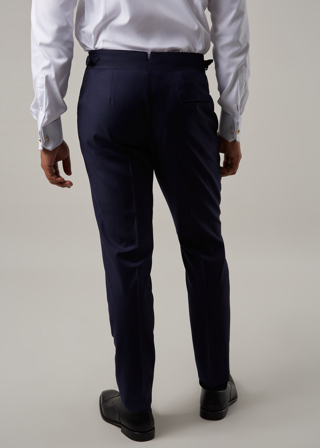 Rialto Royale Navy Suit trousers worn with a white shirt, back view, full length