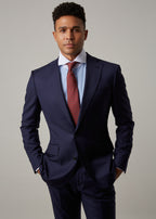 Rialto Royale Navy Suit worn with a rust tie, close-up front view on a model