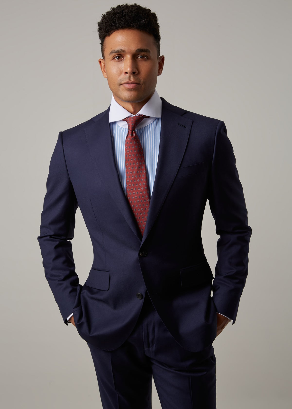 Rialto Royale Navy Suit worn with a rust tie, close-up front view on a model