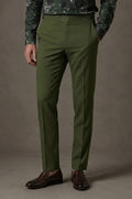Olive Cotton Trousers, front view on a model styled with a green floral shirt and brown penny loafers