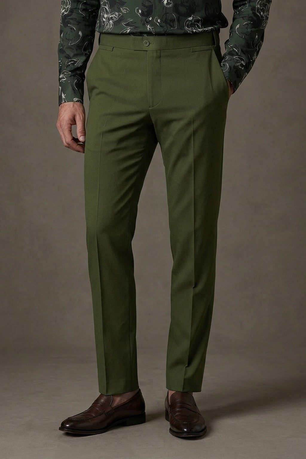 Olive Cotton Trousers, front view on a model styled with a green floral shirt and brown penny loafers