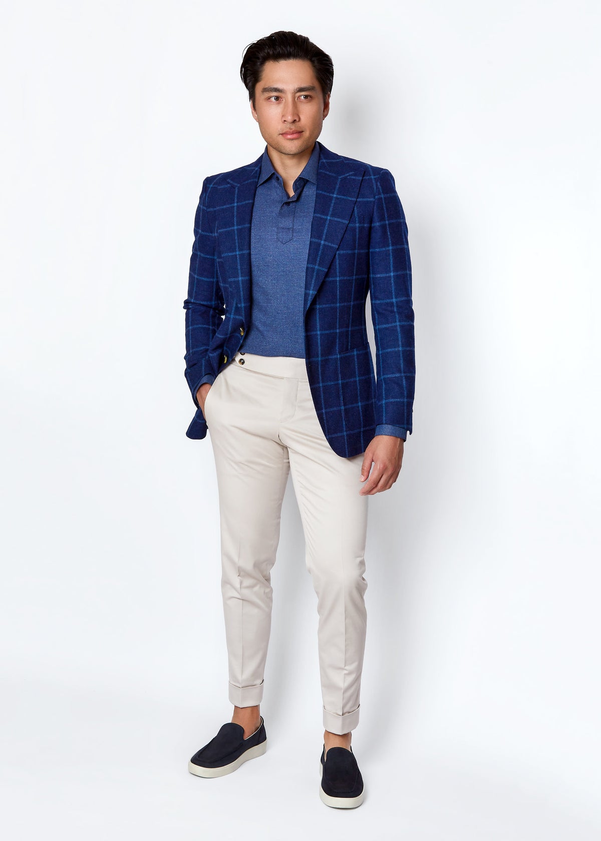 Denim Popover Shirt layered under an open navy windowpane blazer, full length