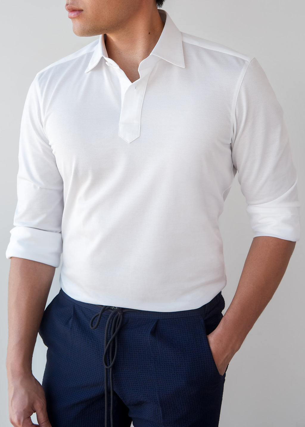 White Popover Shirt worn alone tucked into navy trousers, half-length front view