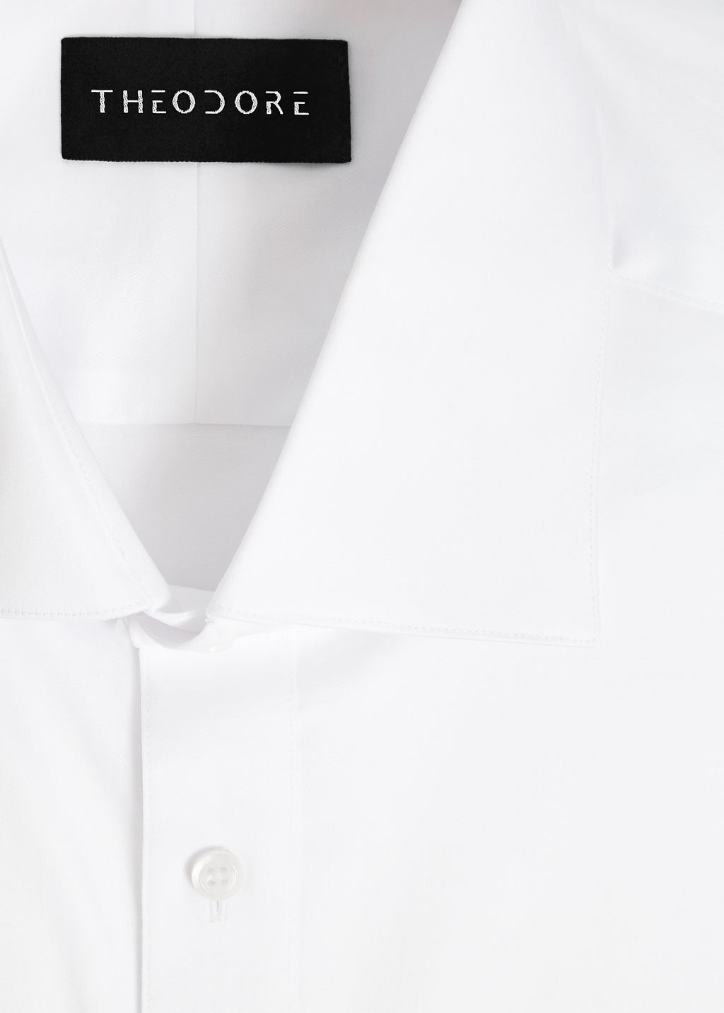 Our Perfect White Shirt collar close-up with the Theodore label, folded flat
