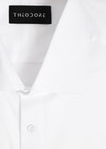 Our Perfect White Shirt collar close-up with the Theodore label, folded flat