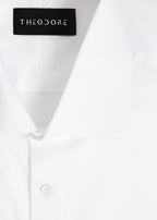 Our Perfect White Shirt collar close-up with the Theodore label, folded flat