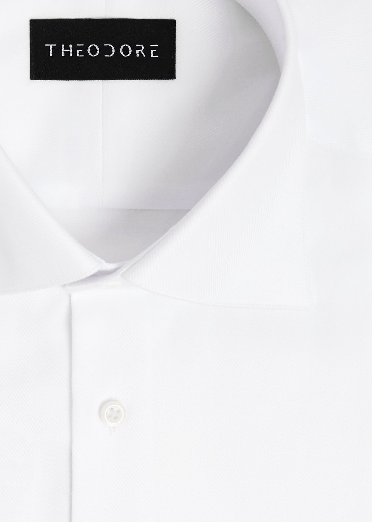 Close-up of the fine herringbone white shirt's collar and top button