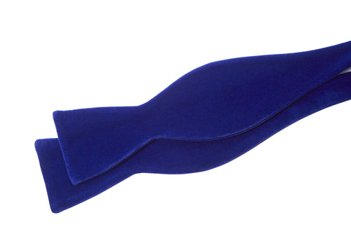 Cobalt Velvet Bow Tie shown untied, laid flat in a draped shape