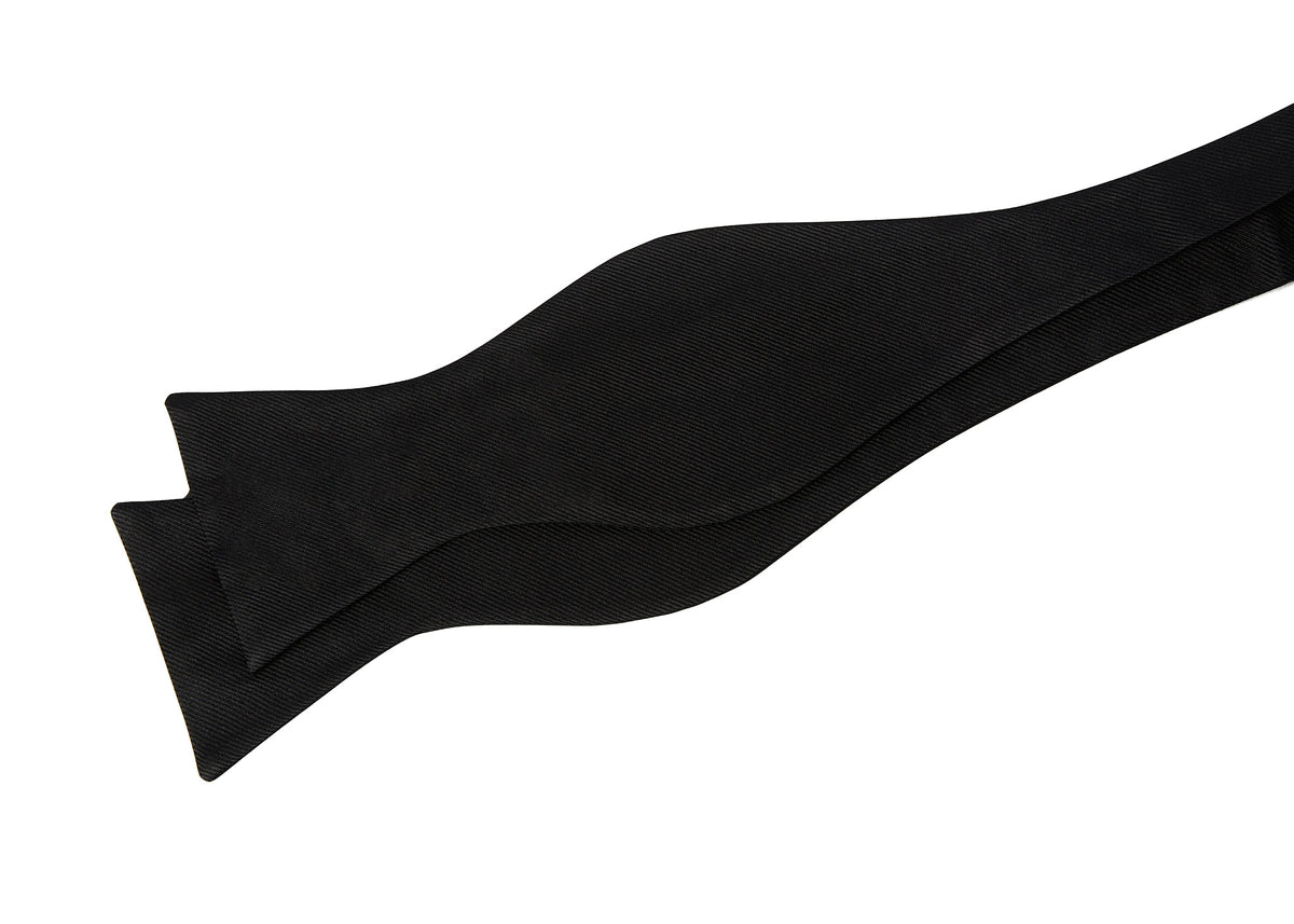 Black Ribbed Silk Bow Tie shown untied, laid flat in a draped shape